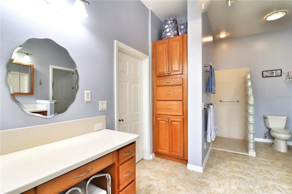 a large walk-in closet that doubles as a storm safe room and a shower enclosure