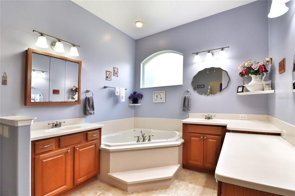 split vanities and a garden tub