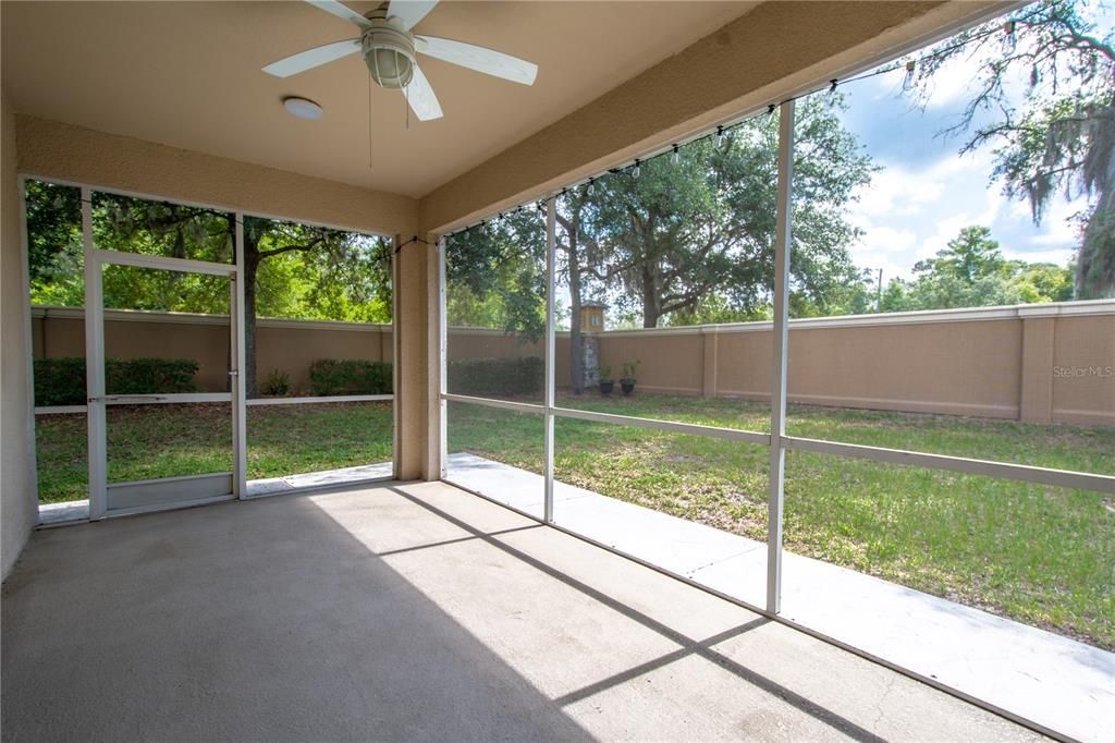 The screened in Lanai overlooks the private yard.