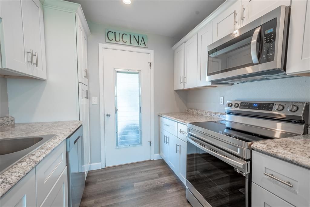 The kitchen is completely updated with Samsung Stainless Steel appliances including a glass top range, built in microwave and dishwasher.