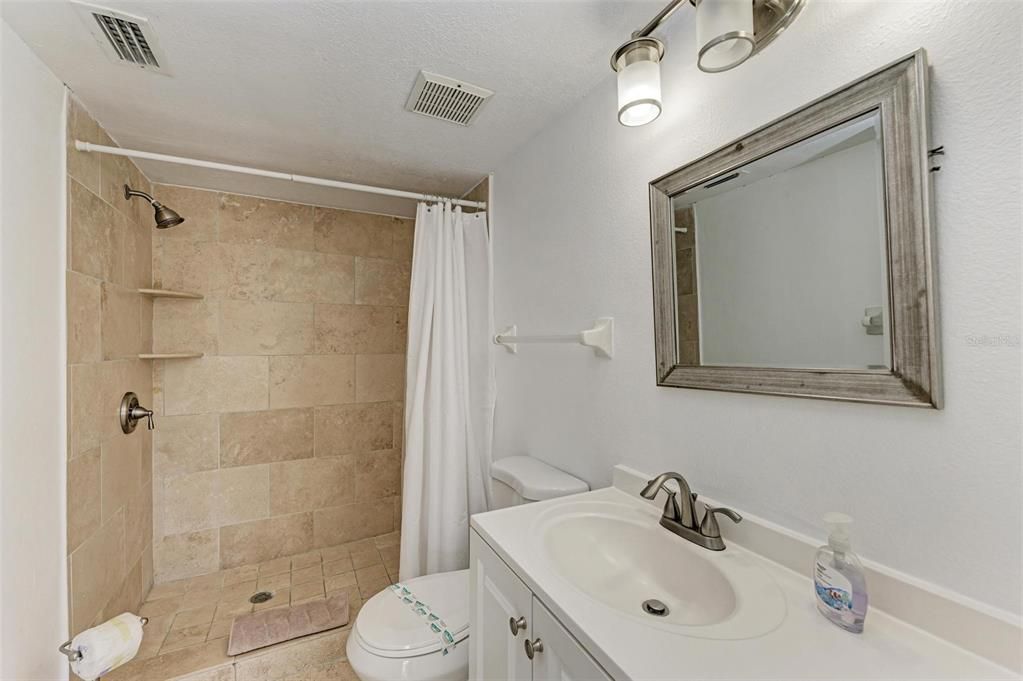 Updated master bath with walk-in shower.  Originally, bath opened to living room and master and they preferred private master.  Can be changed back if desired.