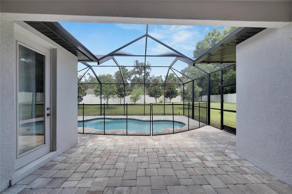 Covered and screened lanai! Pool bath.