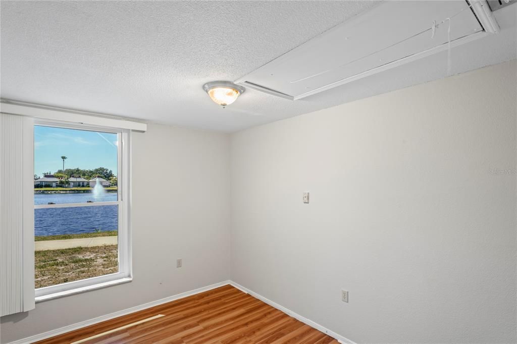 Guest bedroom has the attic pull down stairway for ease of access. Another great water view!