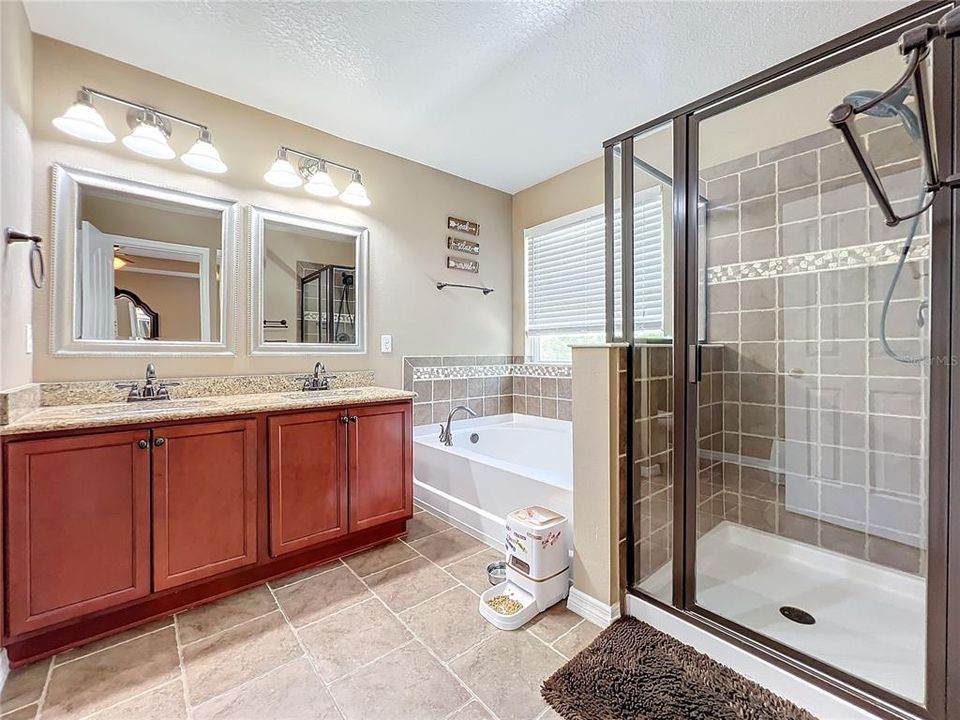 Primary bathroom with separate tub and shower