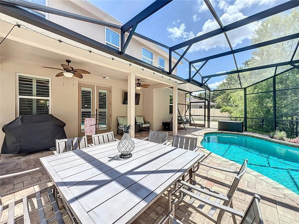 Lanai with entrance to side yard and open patio