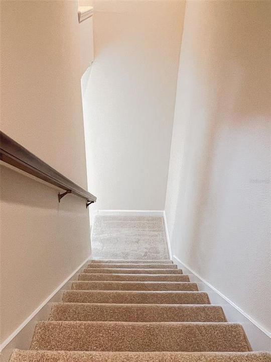 Stairs lead to the loft