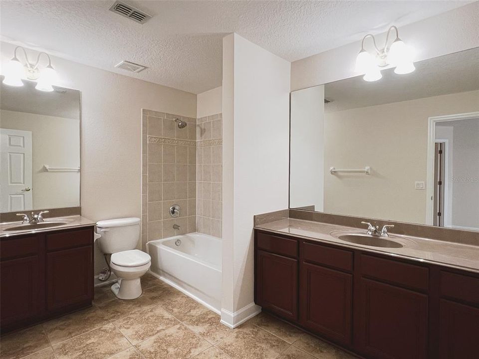 Loft bathroom features two sinks!