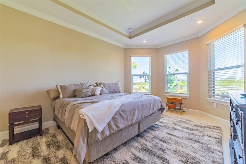 Primary bedroom with bay window sitting area