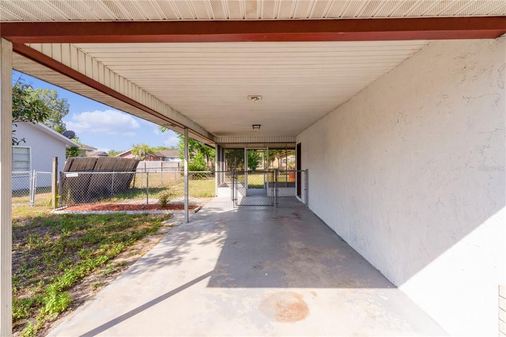 Long carport, with fenced area