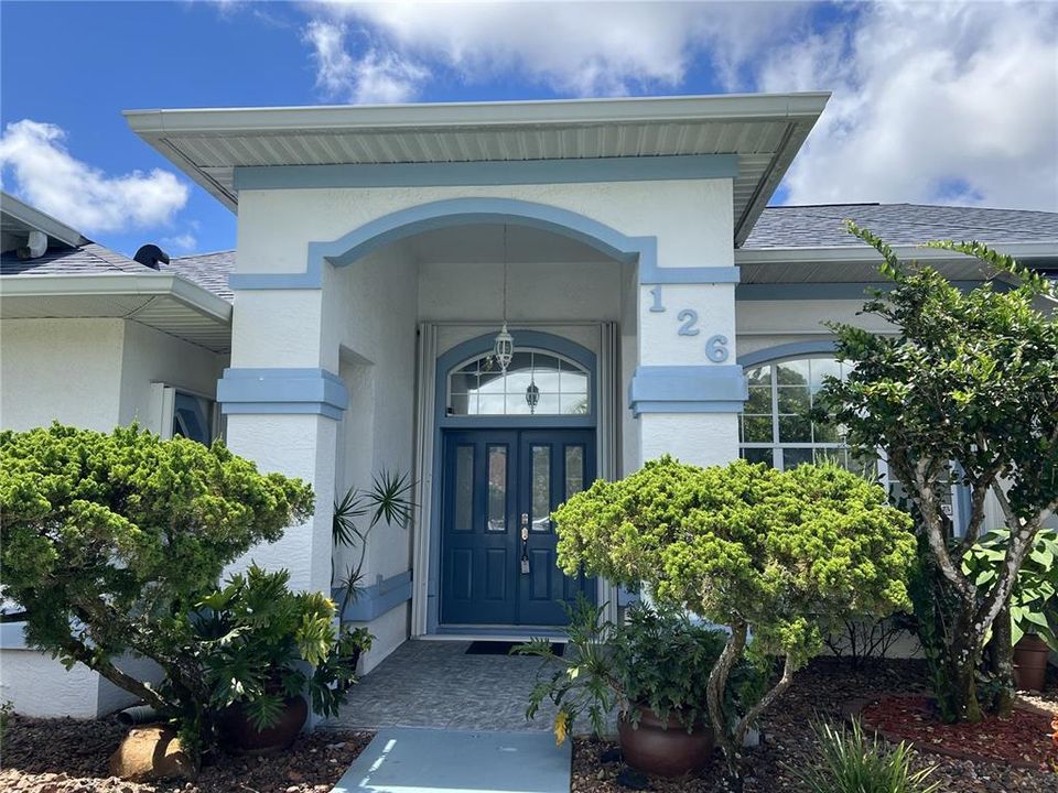 Welcoming Covered Entry With Double Doors