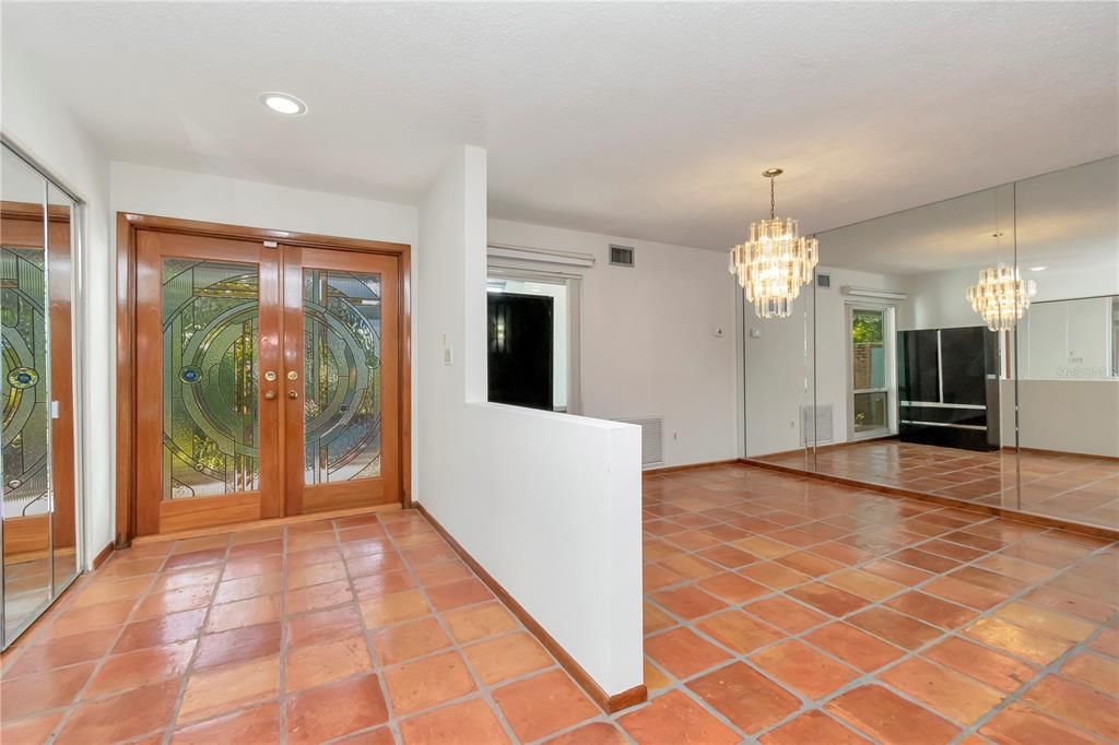 Double Door Entry, Foyer and Formal Dining Room with New Paint, Storage Closet and Tile Floor