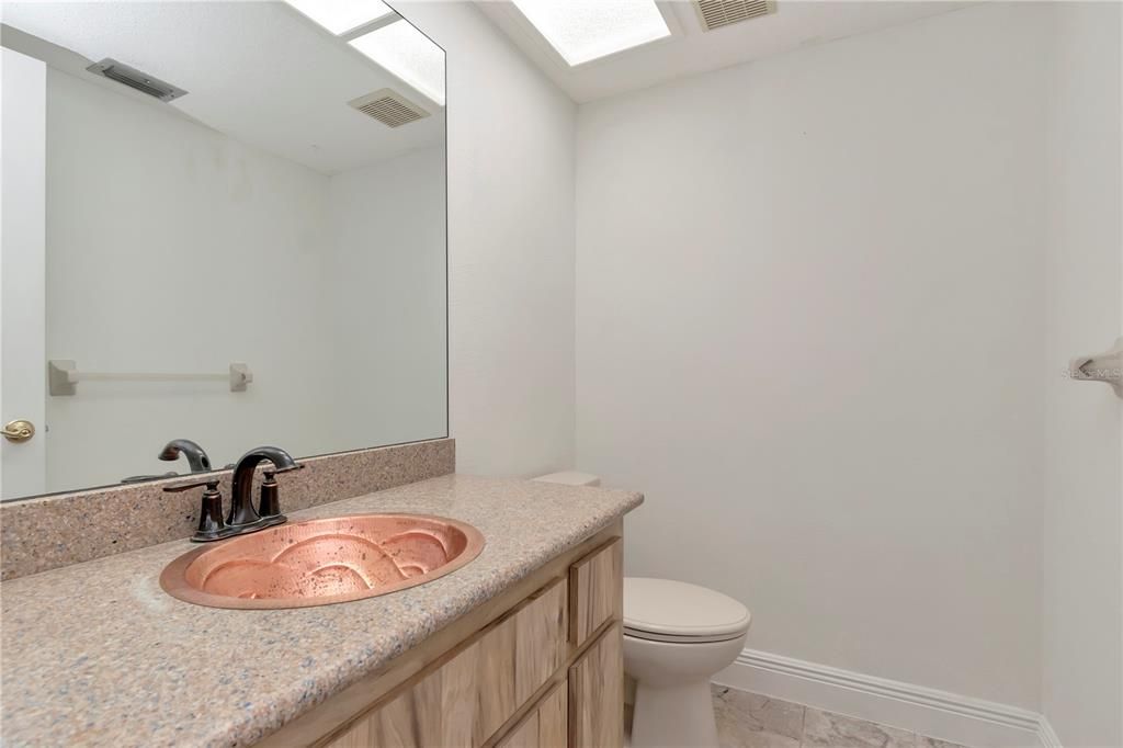 Downstairs half-bath with New Paint, with Vanity Quartz Countertops and Copper Sink, Tile Floor