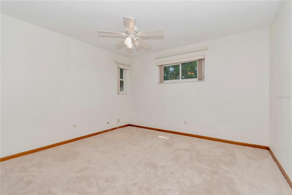 3rd Bedroom with New Paint, New Carpet, Lighted Ceiling Fan and Hurricane-Rated Windows