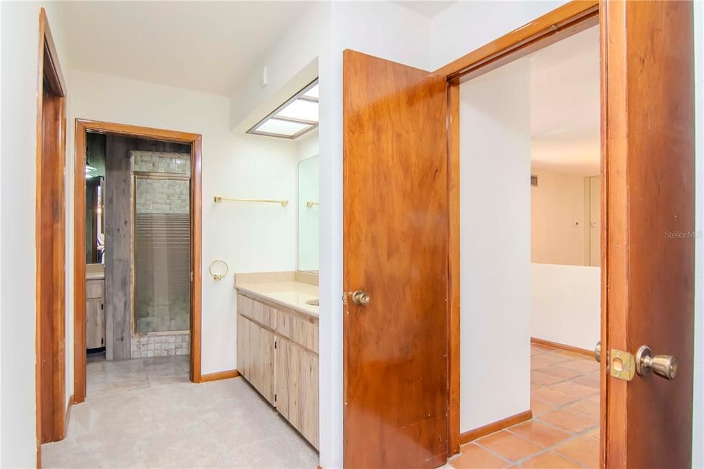 Primary Bathroom Garden Tub and View of Outdoor Space with Hurricane-Rated Windows