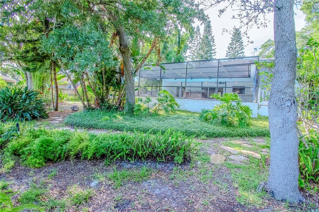 Outdoor Path on Side of Home with Lush Mature Landscaping