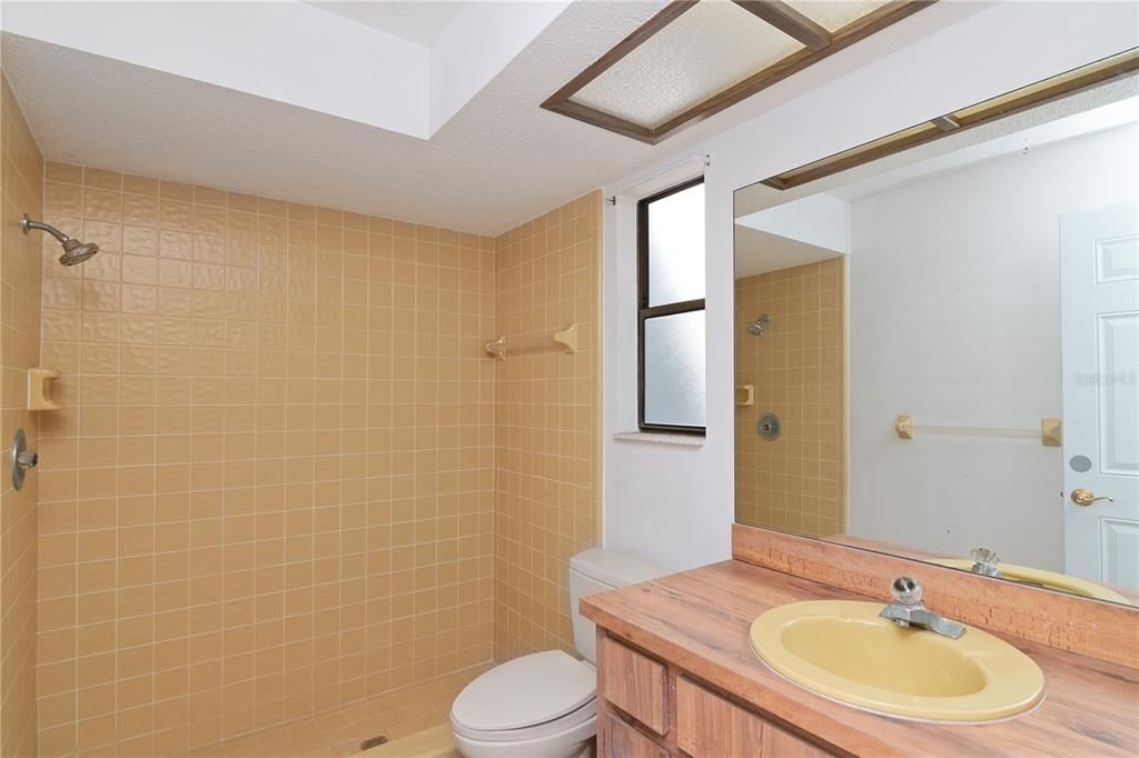 Full Outdoor Bathroom with Tile Flooring