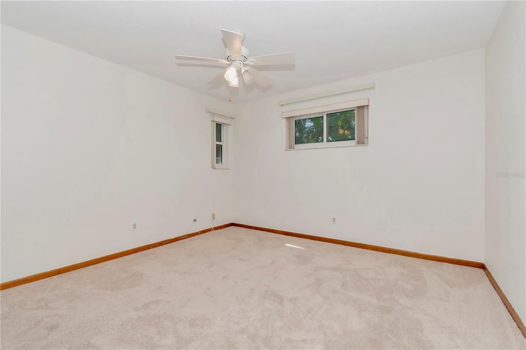 4th Bedroom's Double Closet with Ceiling Fan,  Shutters that overlook Family Room, New Paint and New Carpet