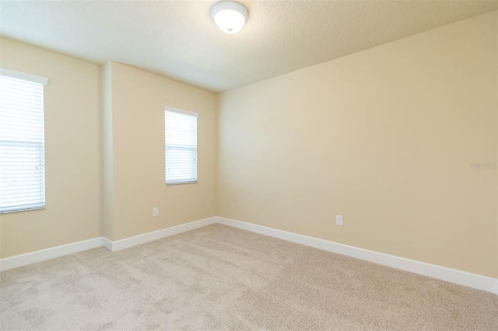 bedroom upstairs with walk in closet