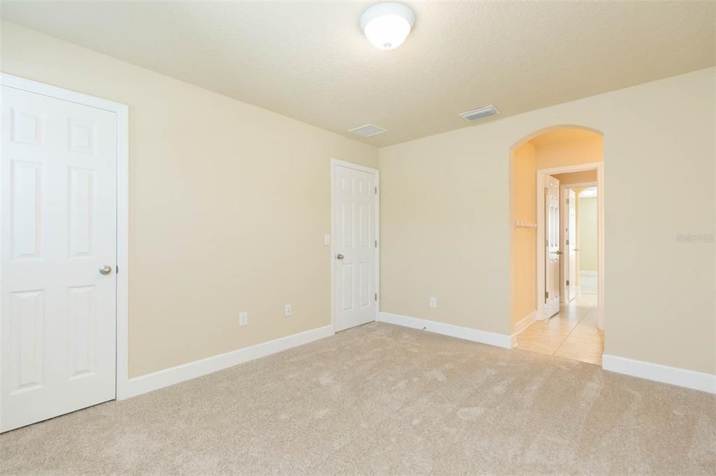 bedroom upstairs with access to jack and jill bath