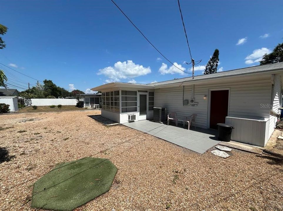 back patio overlooking large backyard