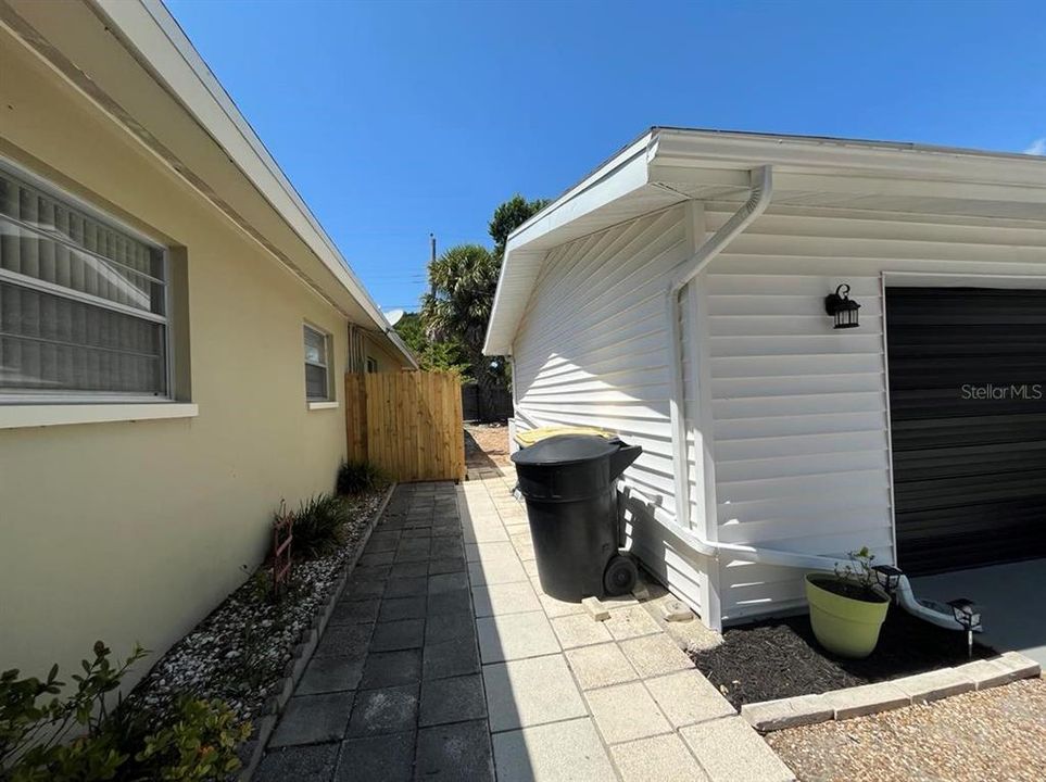 Paved side yard for easy maintenance