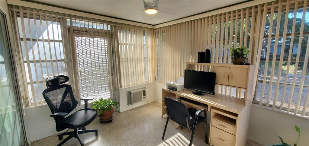 Sunroom with access to backyard