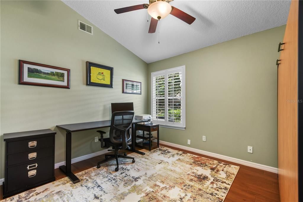 Third bedroom is used as an office. View of the Murphy bed on the right wall.