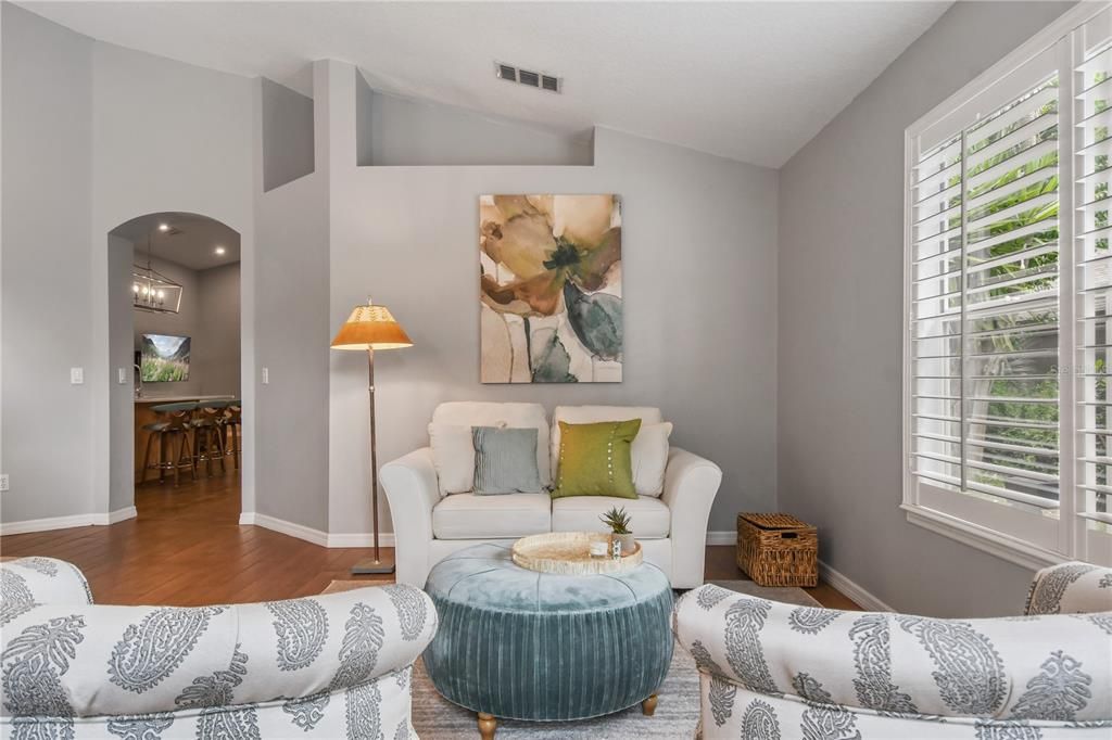 Living room with view of kitchen.