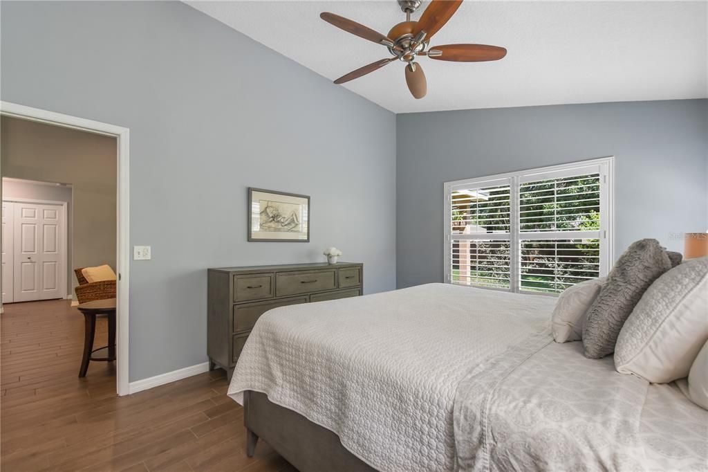 Primary bedroom with view to family room.