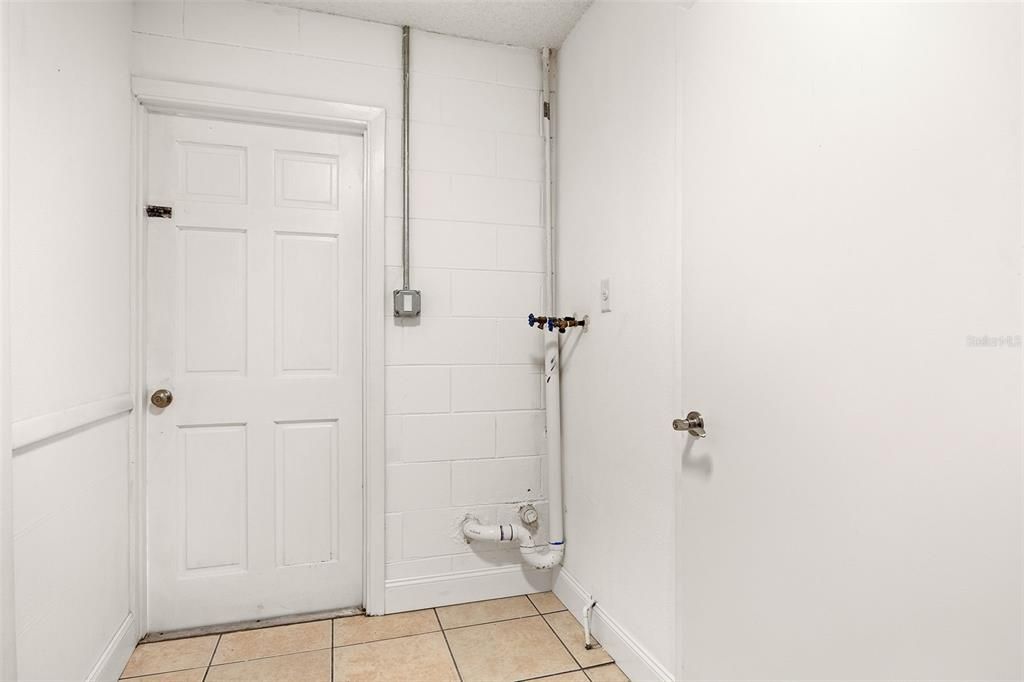 Utility Room off the garage has Washer hook-up. Dryer hook-up is in the garage.