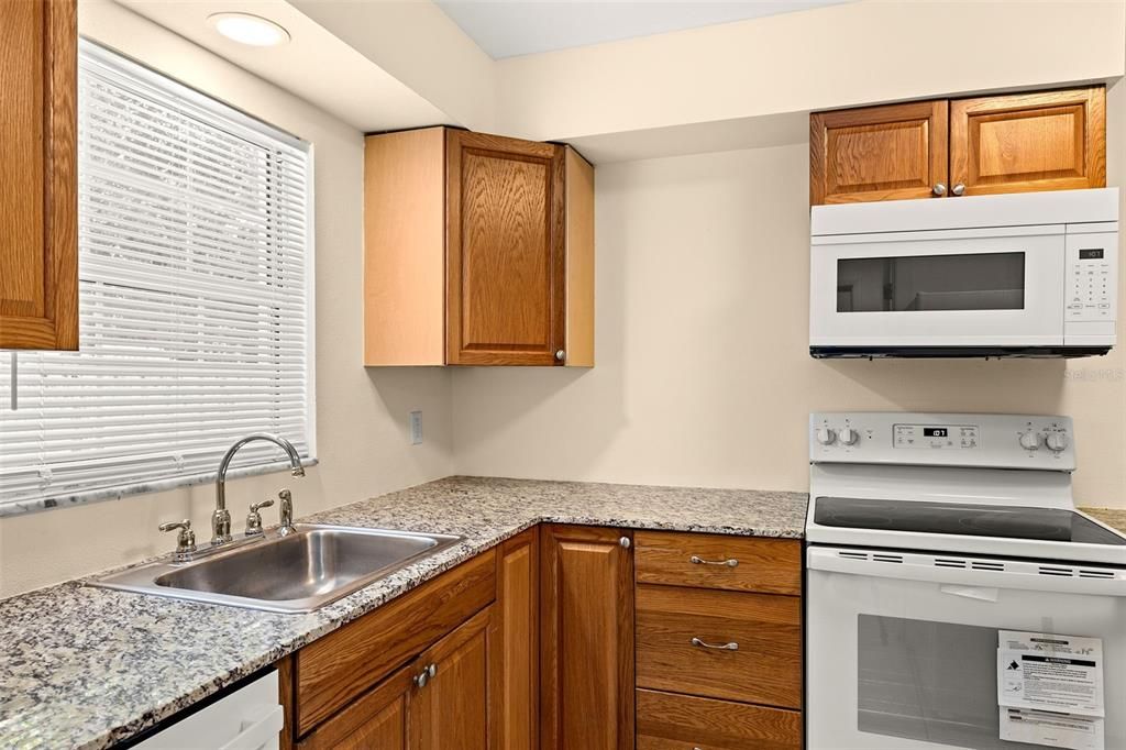 Kitchen has granite countertops.