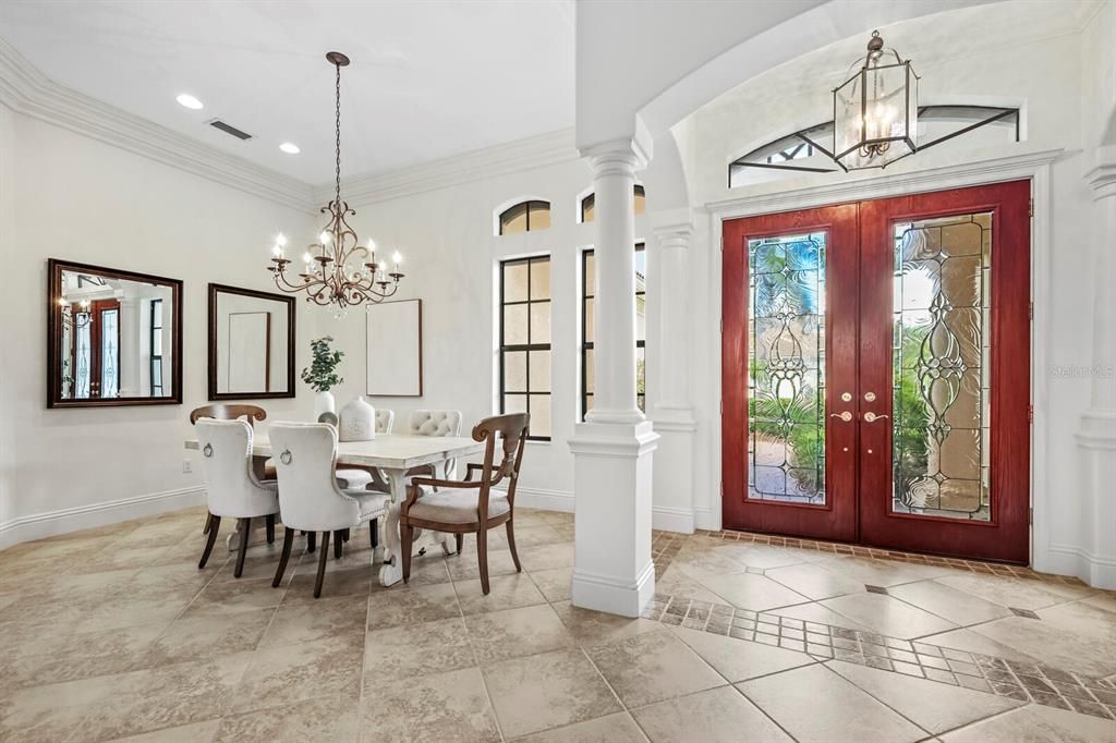 Enter through the stunning double glass doors into the spacious foyer and dining room