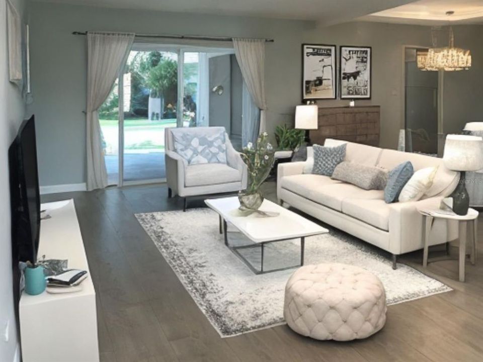 Digitally enhanced with virtual staging to illustrate potential use of the space. The furniture and decor shown do not reflect the actual contents of the property. Prospective buyers are encouraged to visit the property in person to see its true potential and features.