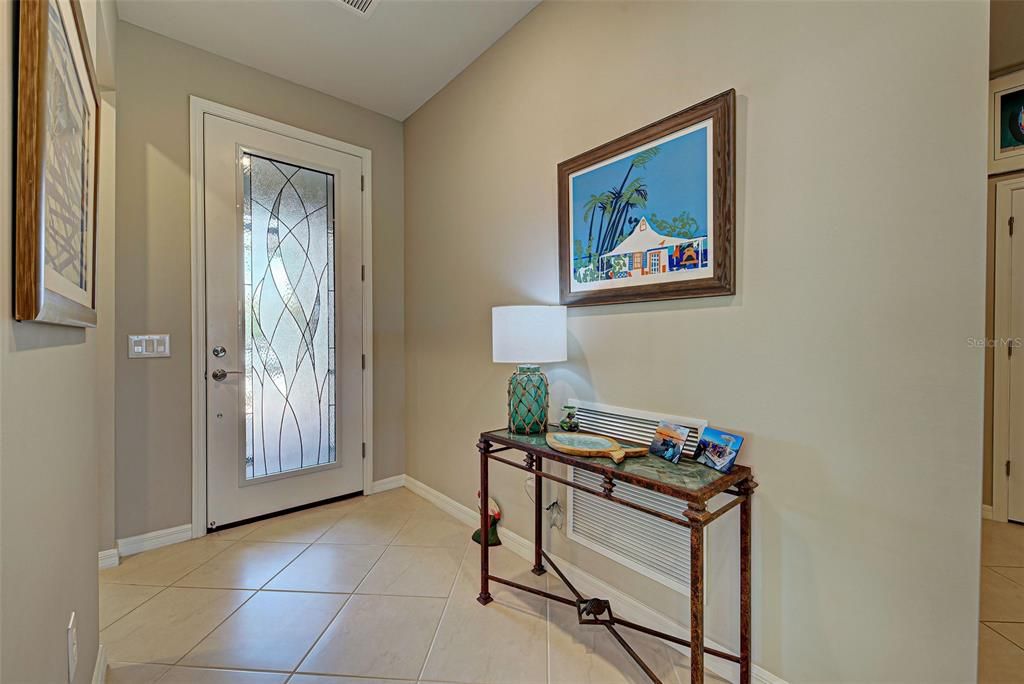 Interior entrance way with impact glass in front door for added light.