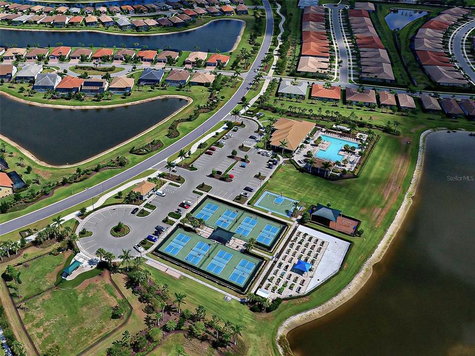 8 of the 12 pickle ball courts, 1 of the 3 swimming pools, half basketball court, fitness center/event center, 2 dog parks, play ground and the community garden.