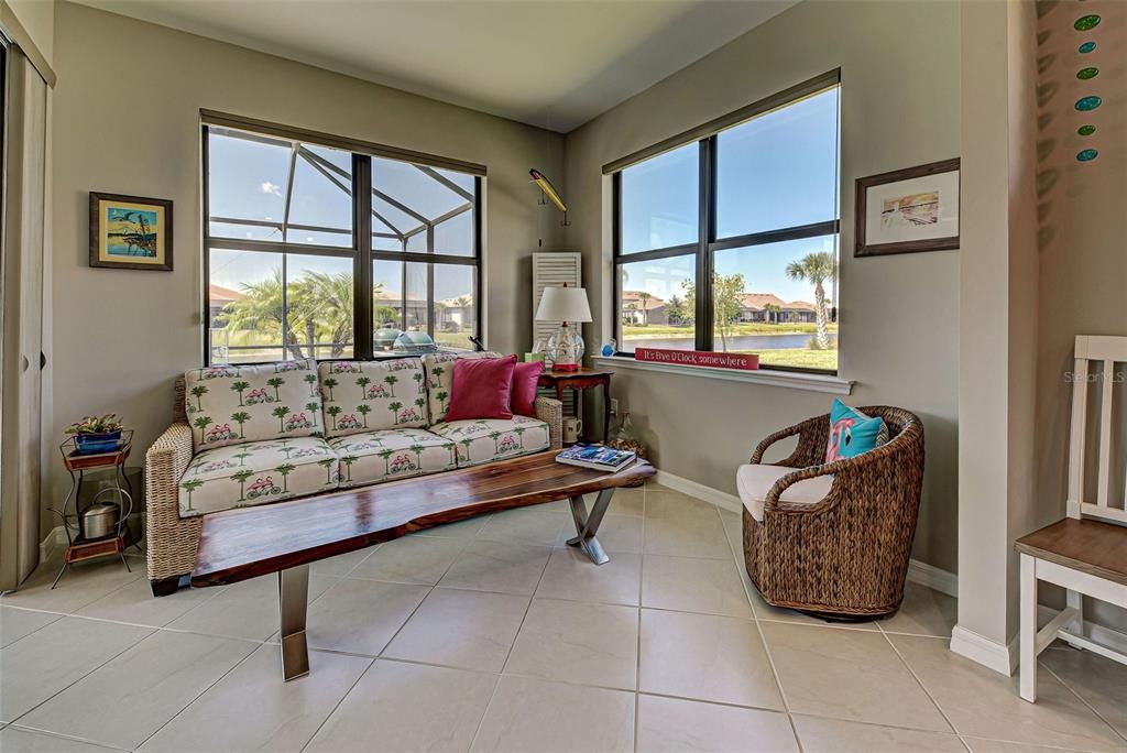 Adorable sun room is perfect for morning coffee or reading time.