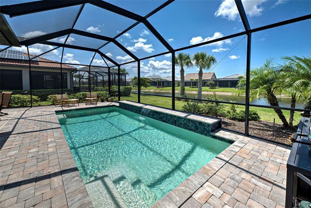 Pool has steps, water fall ledge and sitting ledge.