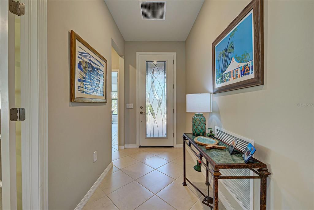 Pretty entrance way, hall to guest bedroom/bath, door to den.