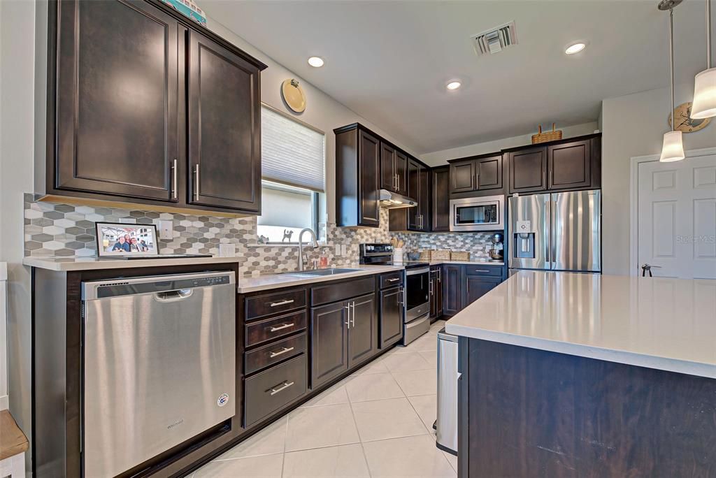 Such a pretty kitchen with raised dishwasher to help save your back!