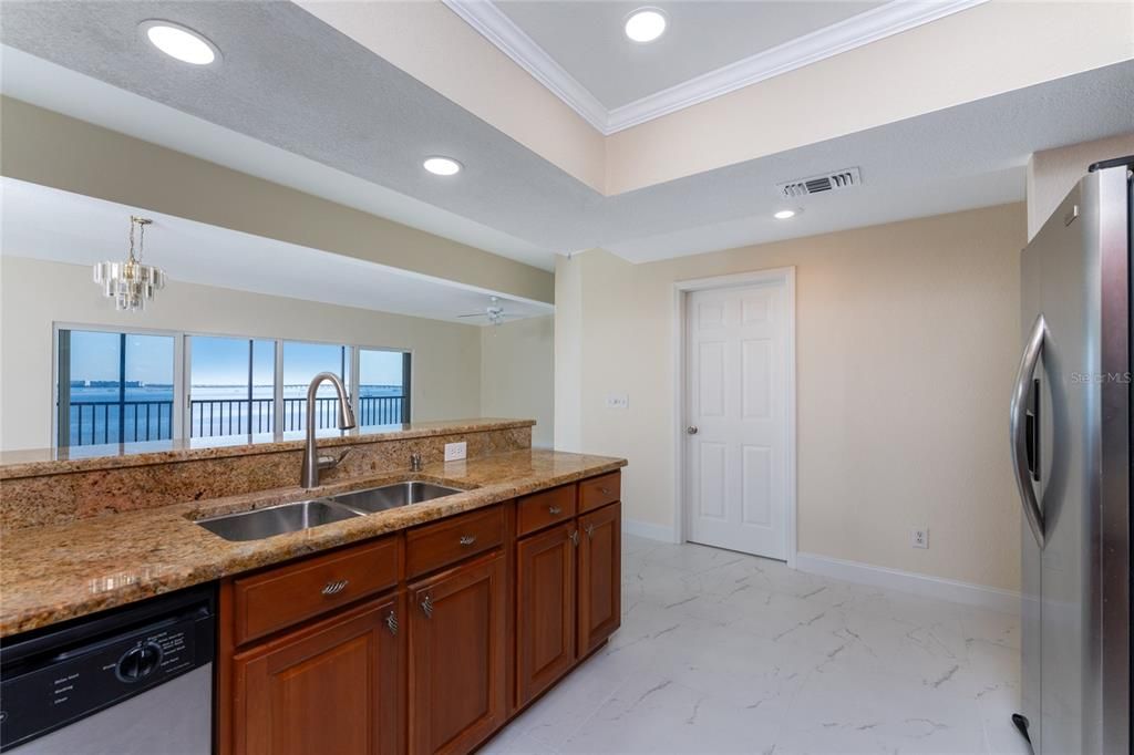 KITCHEN OPENS TO GREAT ROOM