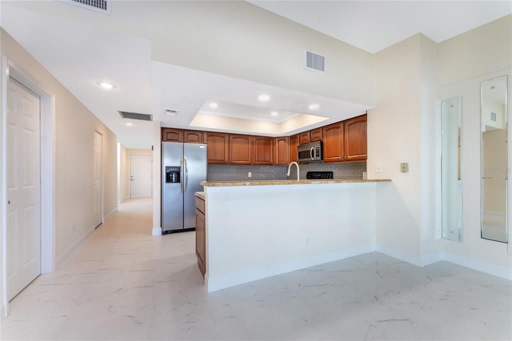 KITCHEN OPENS TO GREAT ROOM