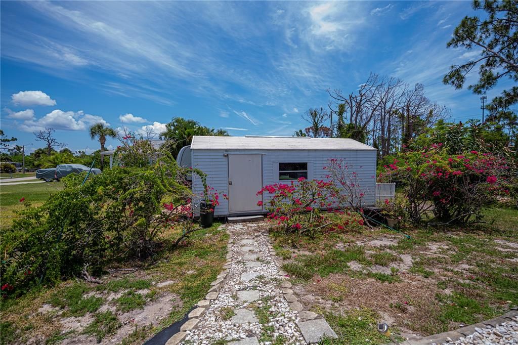 Shed on the included lot to the left of the home