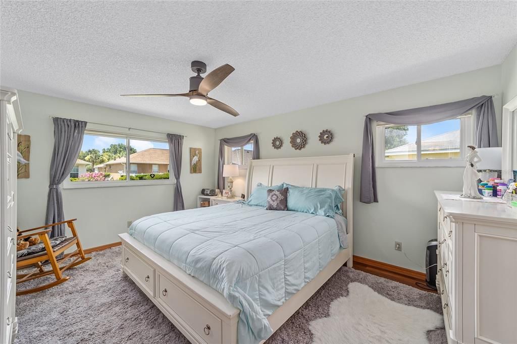 Primary bedroom with lovely backyard views