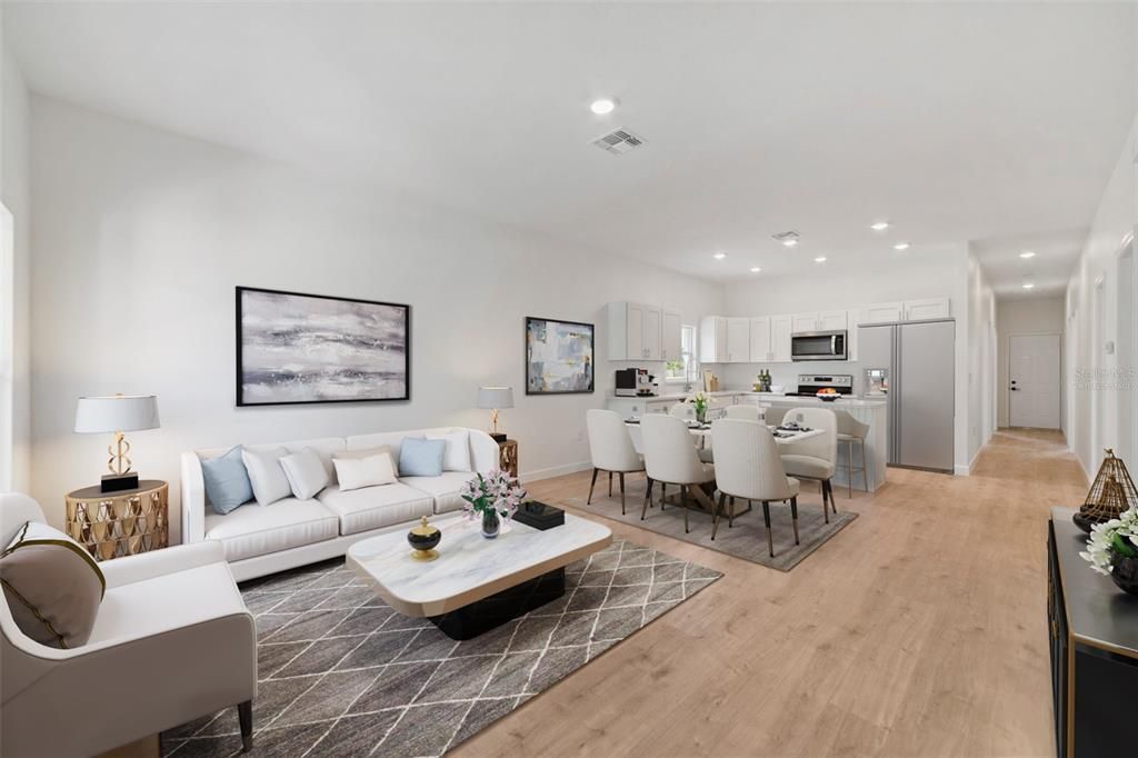 Modern LUXURY VINYL PLANK FLOORS run throughout this home for easy maintenance and a cohesive feel and the fresh neutral color palette adds to the light and bright feel of the OPEN CONCEPT living. Virtually Staged.