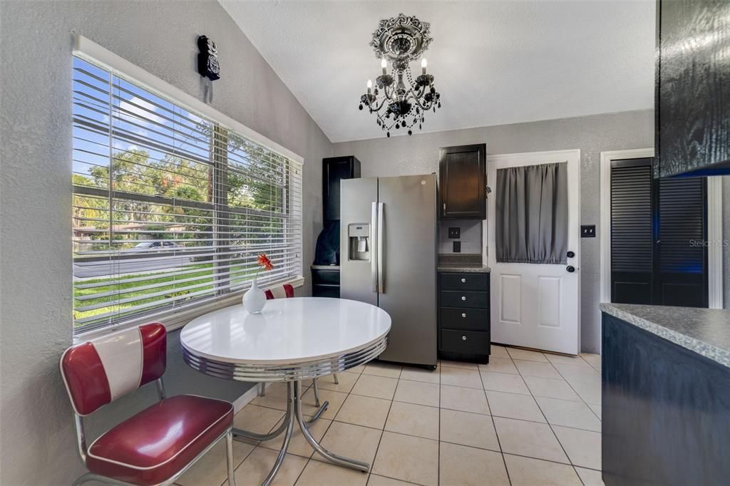 Eat-in kitchen!The comfortable kitchen has a great mix of cabinet and drawer storage, quality appliances, decorative lighting, pantry and access to the SCREENED LANAI.