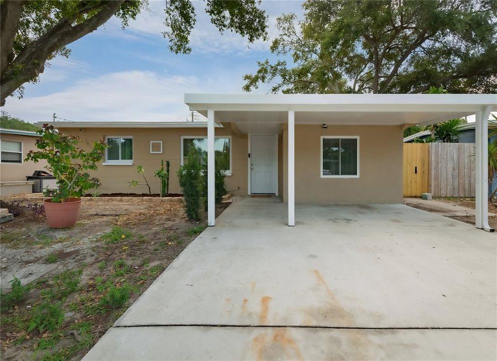 Front of the home with carport and covered entryway