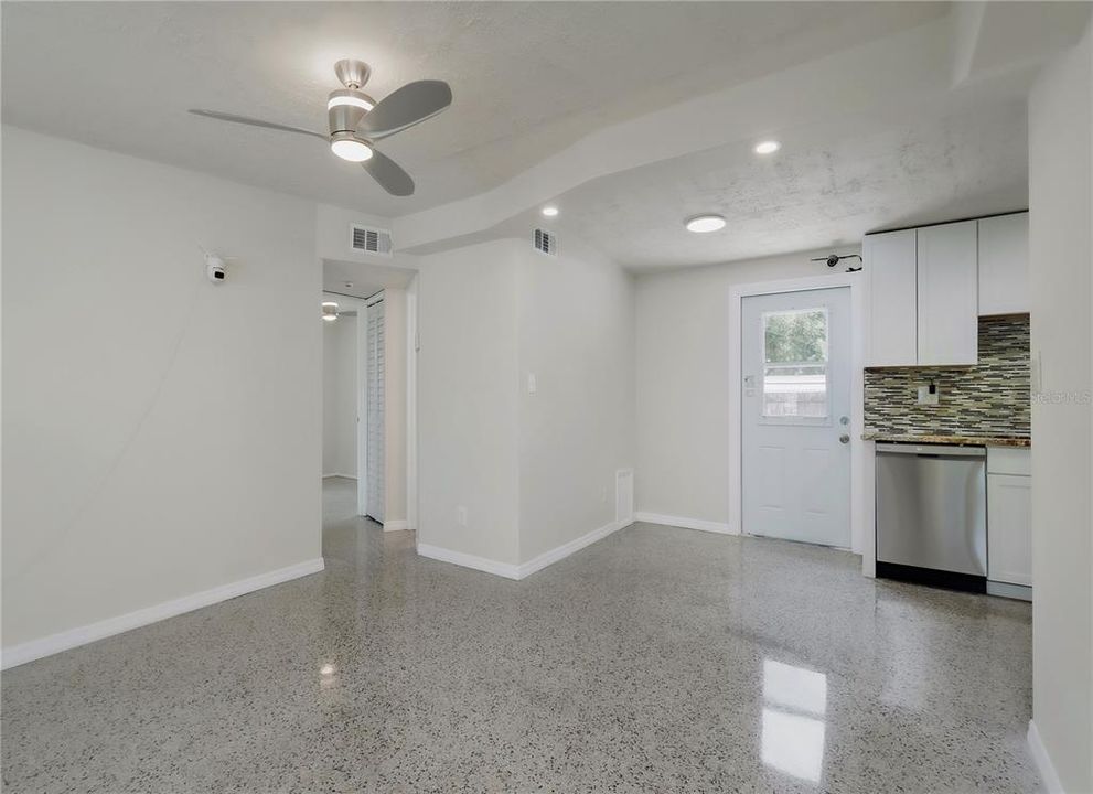 Back door to patio and yard and hallway from living room to additional bedrooms & bathroom