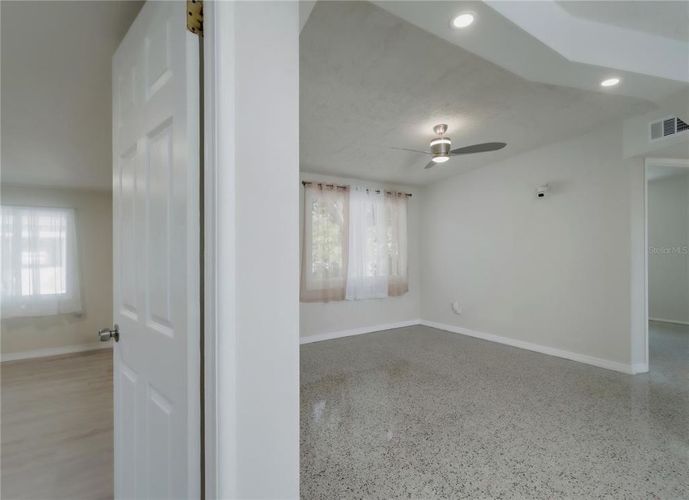 Primary bedroom entrance off of living room/kitchen