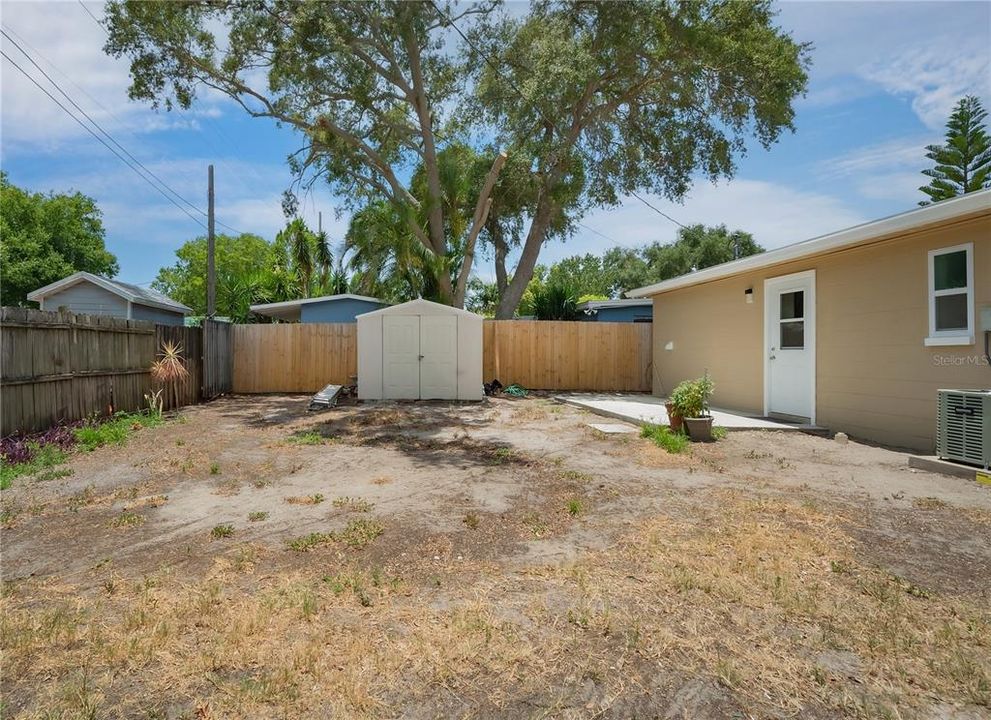 Fenced yard with shed