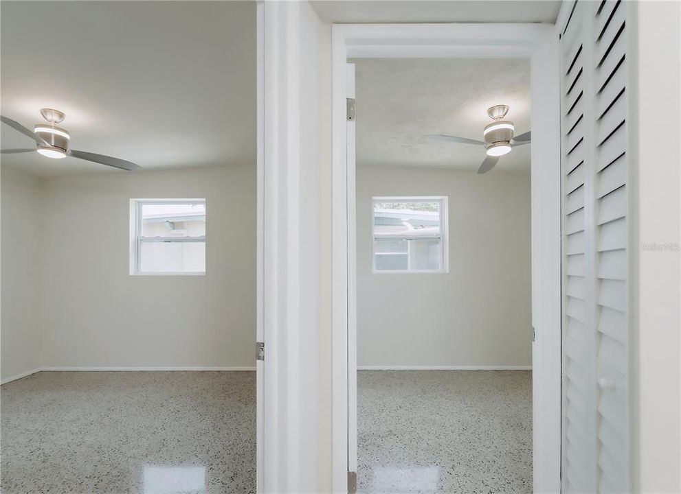 Hallway view of additional two bedrooms